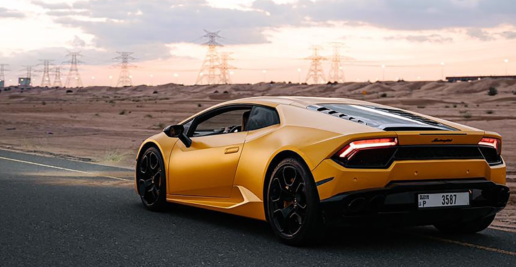 Luxury leased vehicle on California road, representing high-end vehicles covered under California's Lemon Law protection for lessees